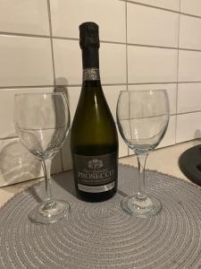 a bottle of wine and two wine glasses on a table at The Lofthouse in Blackpool