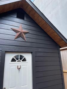 a large brown star above a garage door at Morse Cottage in Houston