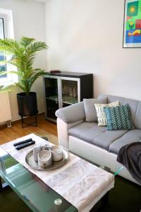 a living room with a couch and a coffee table at Exklusive Ferienwohnung in Meppen in Meppen