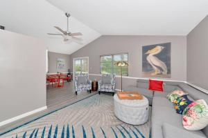 a living room with a couch and a table at Walk to the beach - Island Villa in Siesta Key