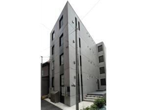 a black and white photo of a building at FL Rejidence Shinjuku 2 - Vacation STAY 15199 in Tokyo