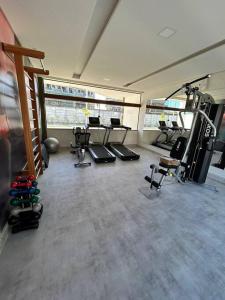 a gym with several treadmills and exercise bikes at Muro Alto - Flat Completo MANA Resort in Porto De Galinhas