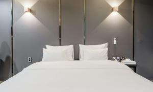 G7 Hotel客房内的一张或多张床位