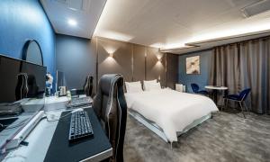 Postel nebo postele na pokoji v ubytování G7 Hotel