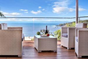 a patio with a view of the ocean at Pambula Family Beach House in Pambula Beach