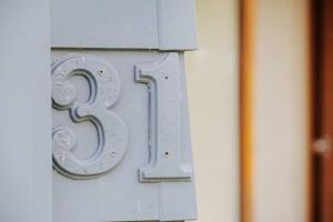 a number on the side of a building at Pambula Family Beach House in Pambula Beach