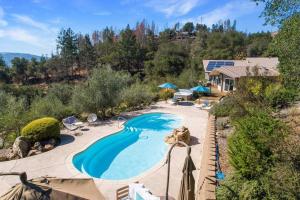 an overhead view of a swimming pool in a backyard at Trinity By Palm House Hospitality Stays in Glen Ellen