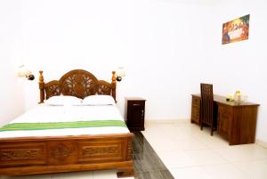 Кровать или кровати в номере Hotel Green Prundi