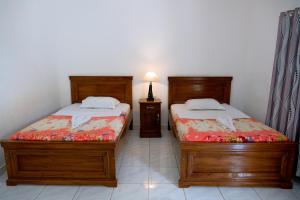 Кровать или кровати в номере Hotel Green Prundi