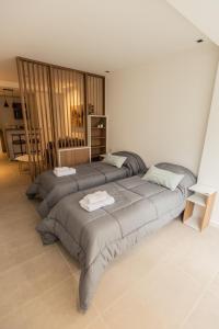- une chambre avec 2 lits dans l'établissement 54 Diseño Urbano, à Ushuaia