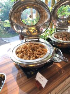 un buffet con diferentes tipos de comida en una mesa en One of A Kind Resort @Trikora Beach - Bintan, 