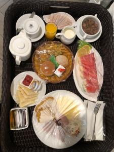 um tabuleiro com pratos de comida numa mesa em One of A Kind Resort @Trikora Beach - Bintan 