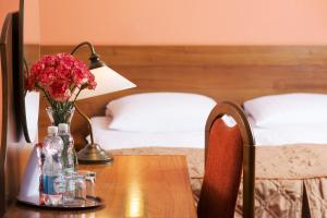 Postel nebo postele na pokoji v ubytování Hotel Regent