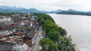 a view of a town next to a body of water at Mekong Chidlatda Villa in Luang Prabang