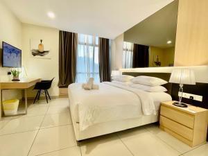 Ένα ή περισσότερα κρεβάτια σε δωμάτιο στο Horizon Homes at Genting Highlands +242 φωτογραφίες