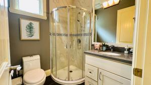 a bathroom with a shower and a toilet and a sink at Quiet Room in Richmond in Richmond