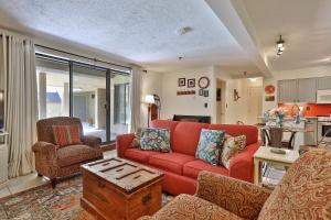 a living room with a red couch and chairs at Mountain Green Condo 3A10 condo in Killington