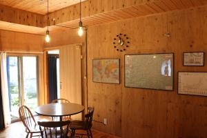 a dining room with a table and chairs at Hostel Fish in a River in Takayama