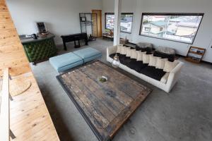 a living room with a couch and a table at Chus in Kuroiso