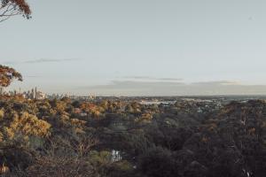 a view of the city from the top of a hill at Cosy studio with a big view in Sydney
