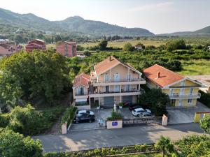 an aerial view of a house with a parking lot at Apartments Royal in Budva