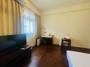 صورة لـ 白紙寓所blank slate B&B-鄰近夜市四人包棟 في ليودونغ