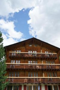 a building with balconies on the side of it at Haus Solvay mit freier Matterhornsicht in Zermatt