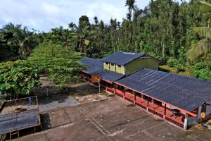 an overhead view of a building with solar panels on it at Leisure Homestay - Pool, Food, Estate in Chikmagalūr