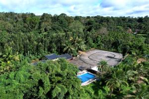 an aerial view of a resort in the jungle at Leisure Homestay - Pool, Boating, Zipline, Home Food, Estate in Chikmagalūr