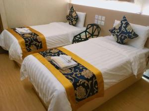 Whole Sunshine International Guest House 객실 침대