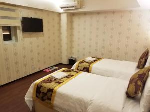 Whole Sunshine International Guest House 객실 침대