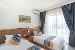Postel nebo postele na pokoji v ubytování M9 Kirirom Hotel