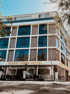 a building with a sign on the front of it at Punta Vista Otel in Izmir