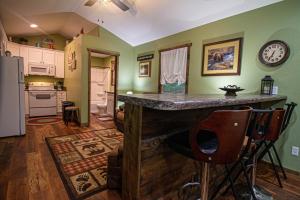a kitchen with a counter in the middle of a room at The Lil House in Robbinsville