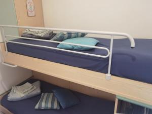 a couple of bunk beds in a room at La piccola oasi tra sole e mare in Ceriale