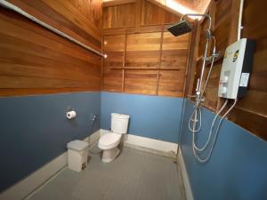 a bathroom with a toilet and a shower in it at Lipe Beach Resort in Ko Lipe