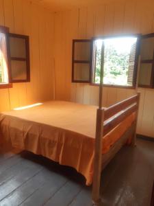 Una cama o camas en una habitación de Casa Mãe - Inn