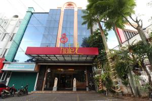 a building with a sign on the front of it at Hotel S3 Setrasari Bandung in Bandung