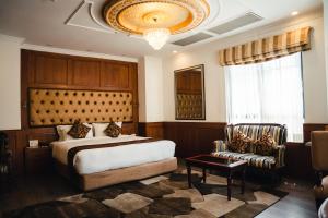 Rúm í herbergi á Maya Manor Boutique Hotel by KGH Group