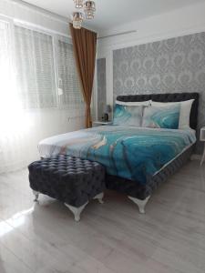 Giường trong phòng chung tại Apartman Star LUX