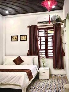 Tempat tidur dalam kamar di SEVEN HOMESTAY(HUE)