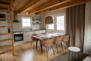 a dining room with a table and chairs in a kitchen at Västervik Resort in Västervik