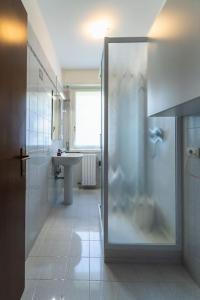 a bathroom with a shower and a sink at Casa Magnodeno in Lecco