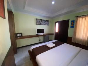 TV a/nebo společenská místnost v ubytování Dedy Beach Inn