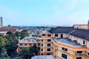 an overhead view of a city with buildings at Cottonwood Midcentury Apartment at Majesty 811 in Bandung