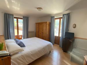 Postel nebo postele na pokoji v ubytování Hotel Col Serena