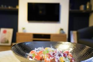 a bowl of food on a table in a living room at Enfield North London 3BR Apartment in London
