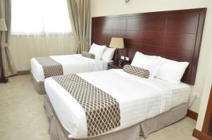 Giường trong phòng chung tại Addissinia Hotel