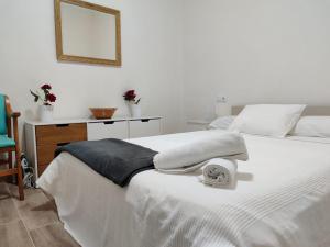 Postel nebo postele na pokoji v ubytování Angy Home Chueca Gran Via