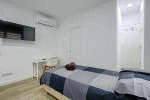 Łóżko lub łóżka w pokoju w obiekcie Casa de Huéspedes 12 Octubre Rooms